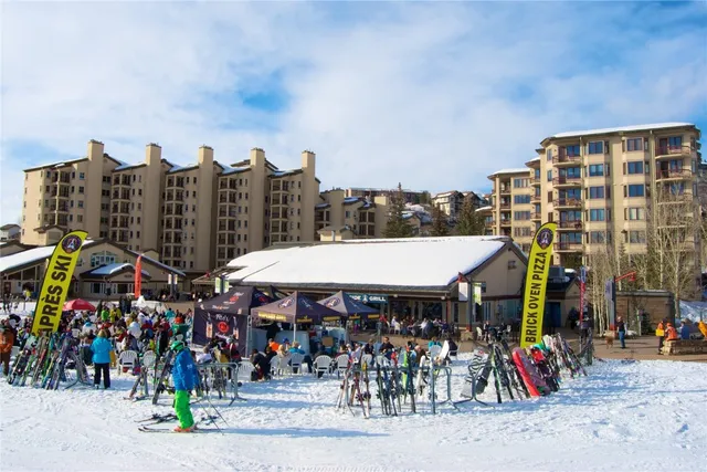 a group of people sitting in front of building