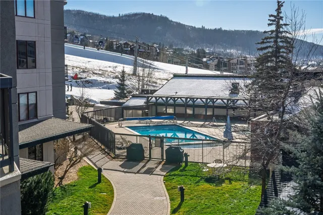 a view of a balcony with two chairs and a table