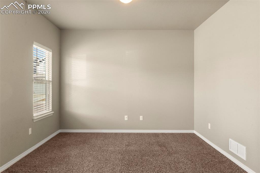 6105 Fiddle Way Colorado Springs, CO 80925 - Photo 13 of 40 an empty room with windows