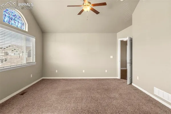 a view of an empty room with a window