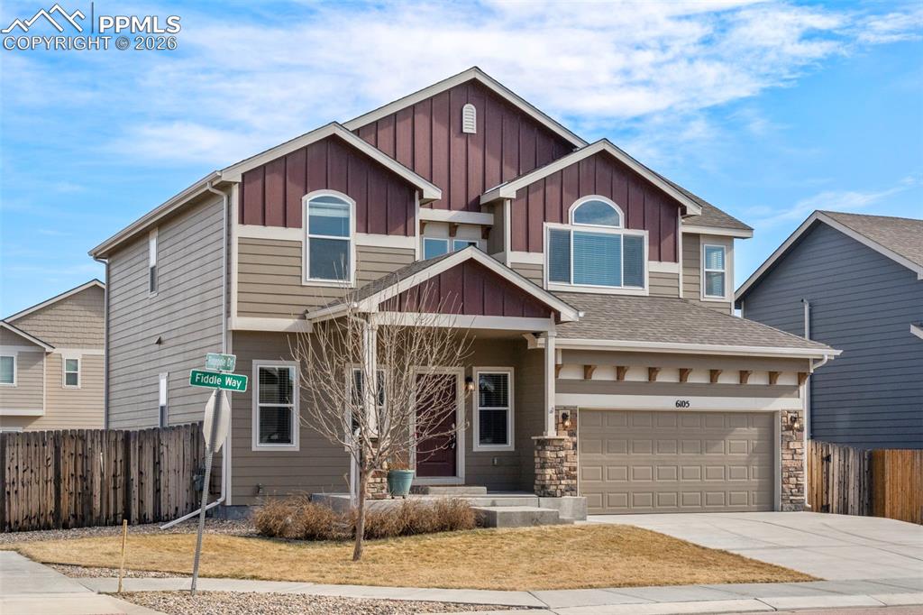 6105 Fiddle Way Colorado Springs, CO 80925 - Photo 2 of 40 a front view of a house with a garden