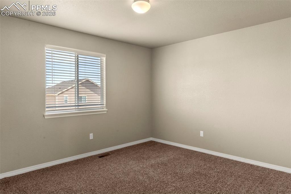 6105 Fiddle Way Colorado Springs, CO 80925 - Photo 22 of 40 an empty room with a window