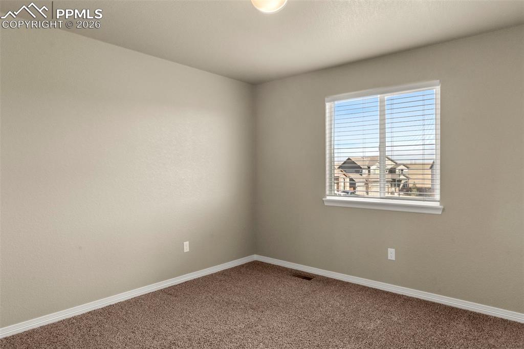 6105 Fiddle Way Colorado Springs, CO 80925 - Photo 23 of 40 an empty room with a window