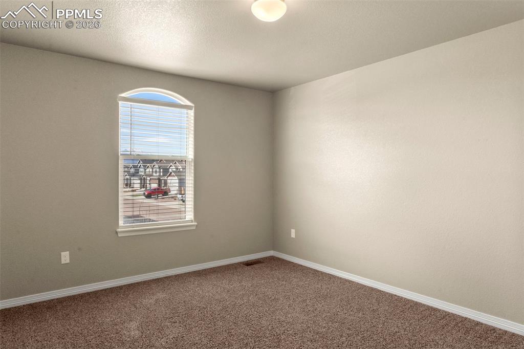 6105 Fiddle Way Colorado Springs, CO 80925 - Photo 25 of 40 an empty room with a window