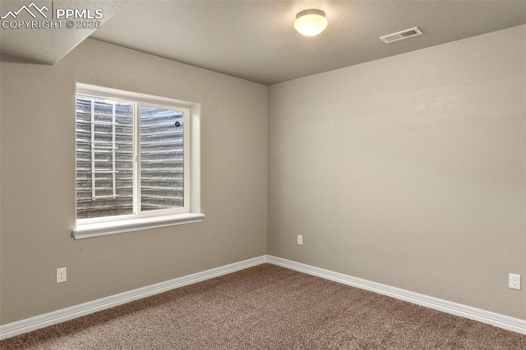 6105 Fiddle Way Colorado Springs, CO 80925 - Photo 28 of 40 an empty room with a window