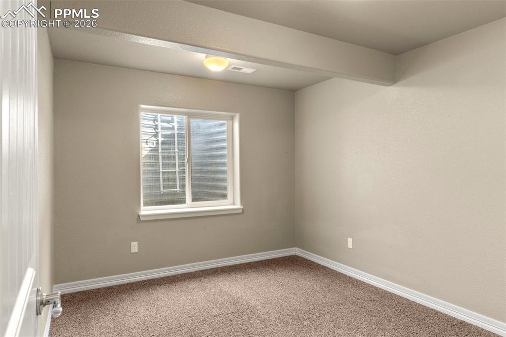6105 Fiddle Way Colorado Springs, CO 80925 - Photo 30 of 40 an empty room with a window