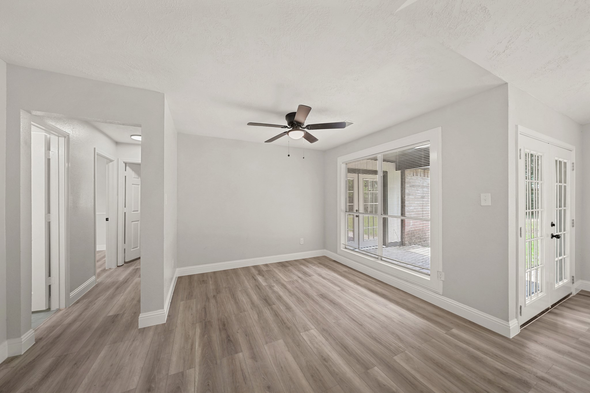 3623 Peachstone Place Spring, TX 77389 - Photo 4 of 20 a view of empty room with wooden floor and fan