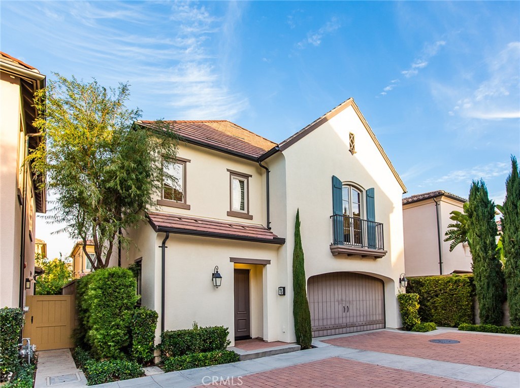 75 Gardenstone Path Irvine, CA 92620 - Photo 43 of 65 a front view of a house with a yard garage and outdoor seating
