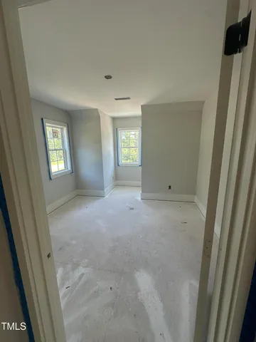 a view of empty room with windows