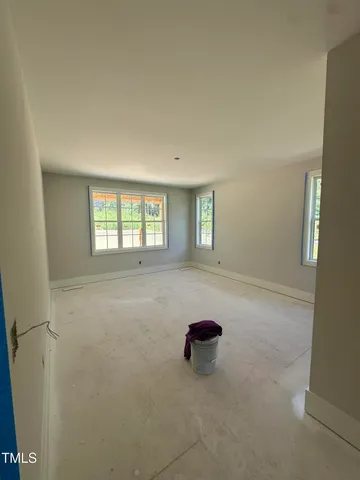 a view of empty room with windows