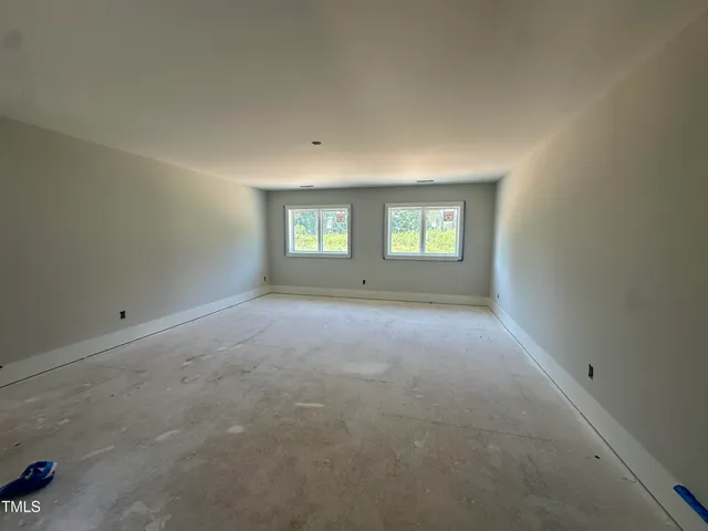 a view of empty room with windows