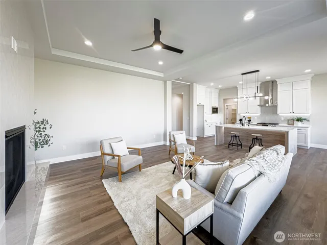 a spacious bedroom with a bed and a ceiling fan