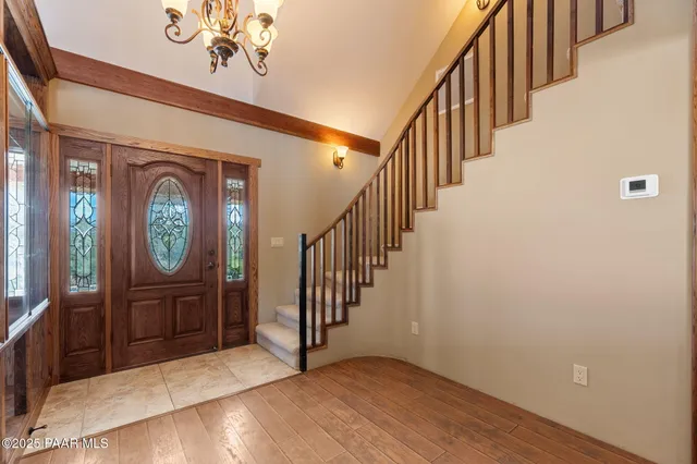 an empty room with furniture fireplace and windows