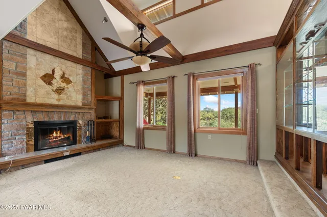a kitchen with stainless steel appliances kitchen island granite countertop a sink and cabinets