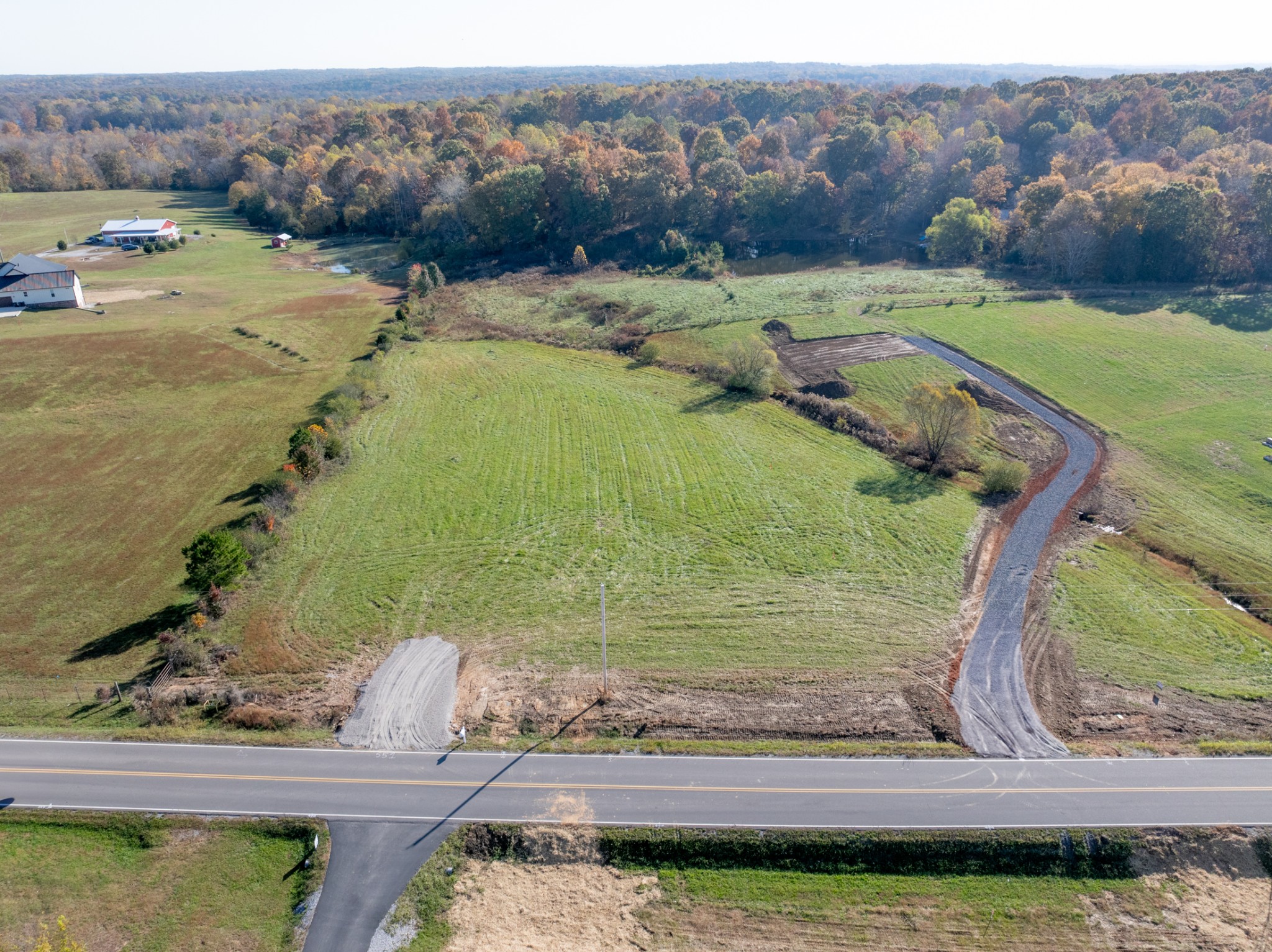 555 Buddy Road Burns, TN 37029 - Photo 22 of 23 a view of a garden with an outdoor seating