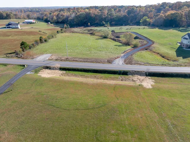 a view of a lake with a yard