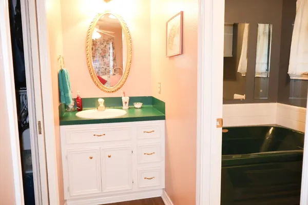 a bathroom with a sink and a window