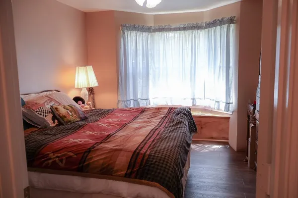 a bathroom with a shower curtain and a window