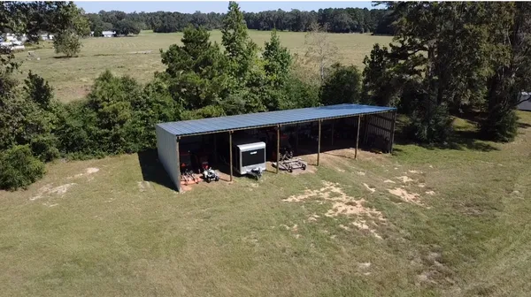 a view of a backyard of the house