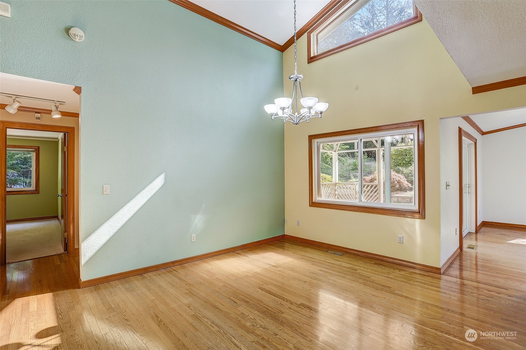 18600 East Spring Lake Drive Southeast Renton, WA 98058 - Photo 11 of 39 a view of an empty room with wooden floor and a window