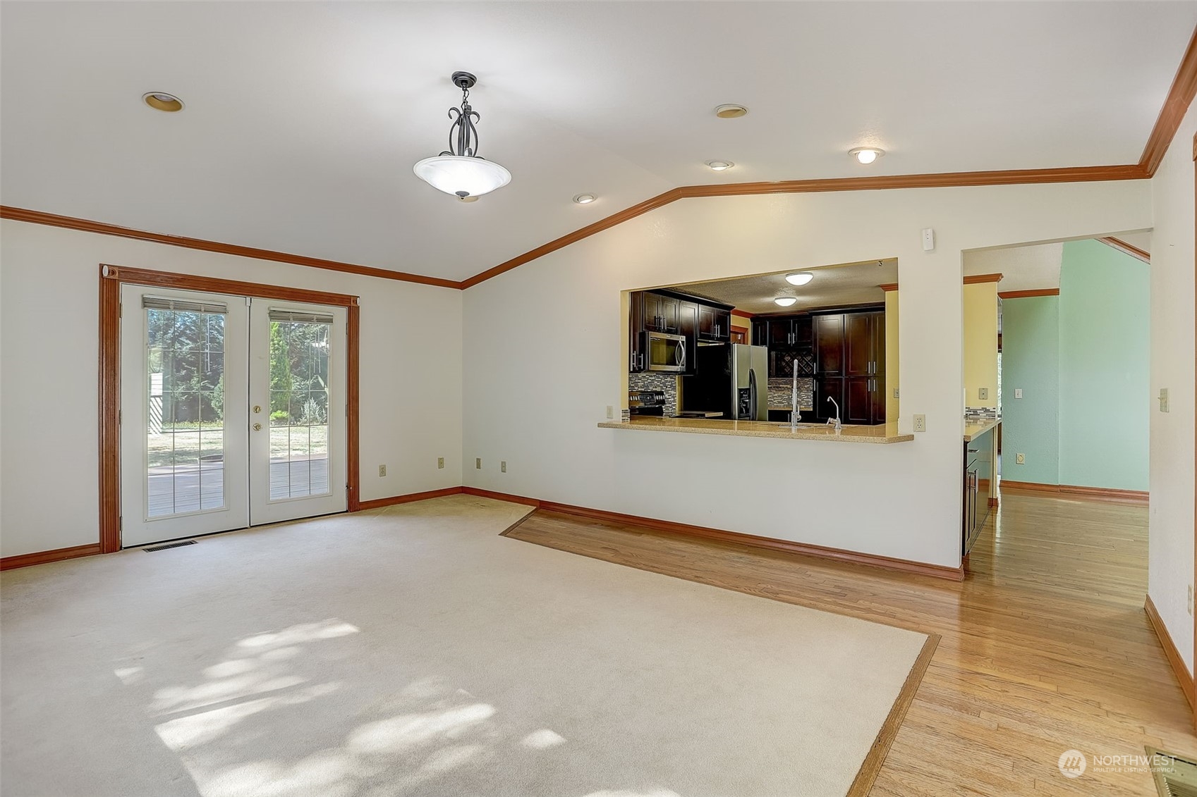 18600 East Spring Lake Drive Southeast Renton, WA 98058 - Photo 15 of 39 a view of a livingroom with wooden floor and a large window