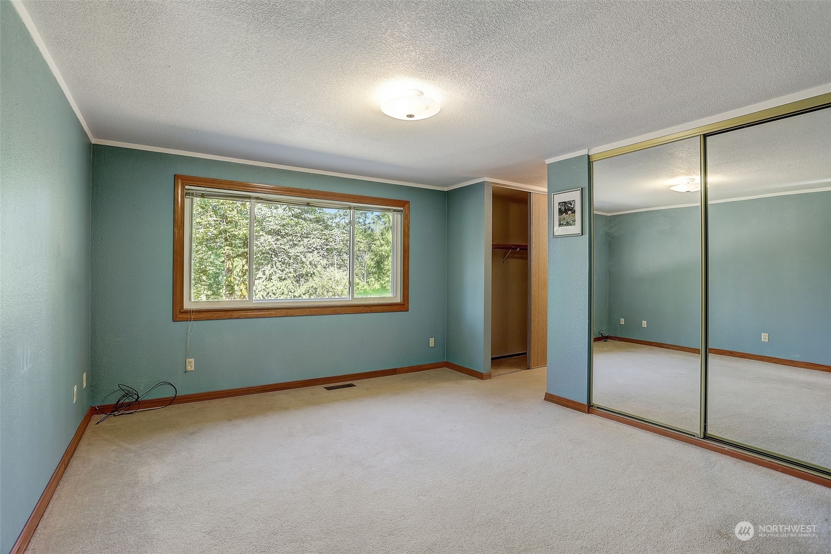 18600 East Spring Lake Drive Southeast Renton, WA 98058 - Photo 17 of 39 an empty room with sliding door