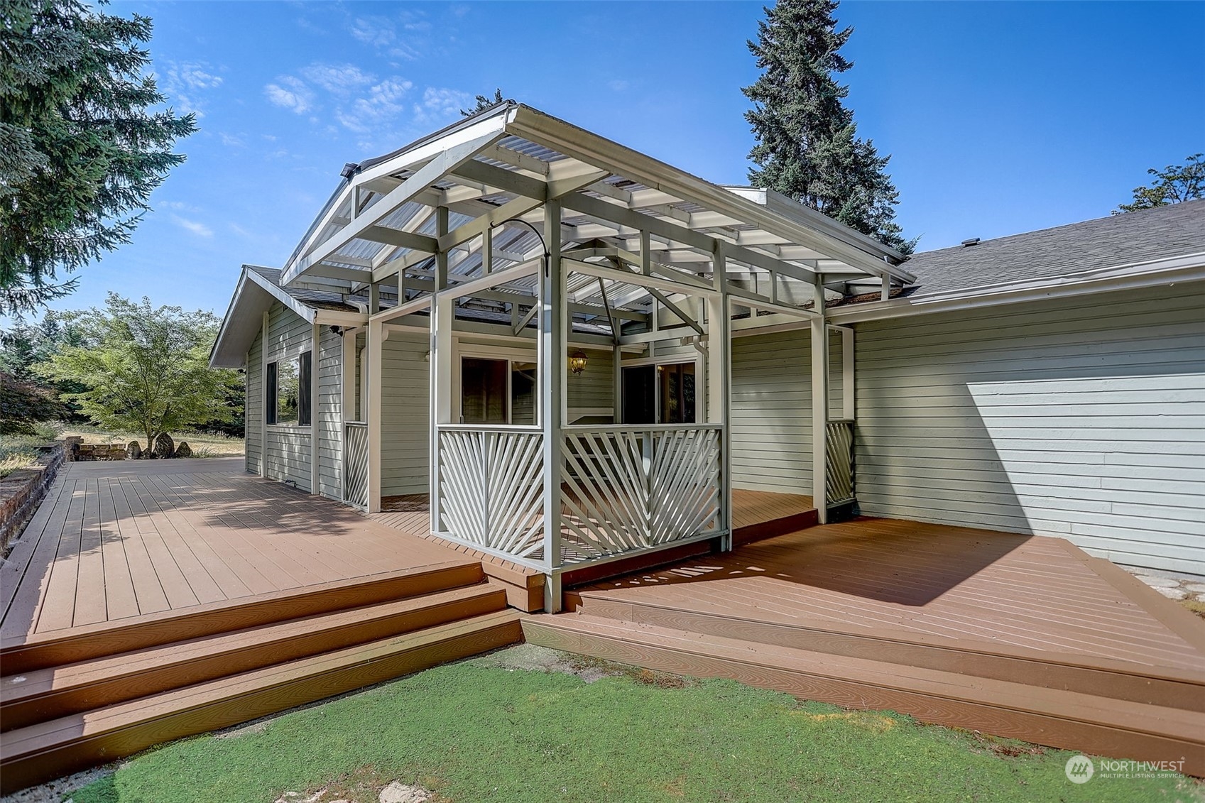 18600 East Spring Lake Drive Southeast Renton, WA 98058 - Photo 2 of 39 a front view of a house with a garden