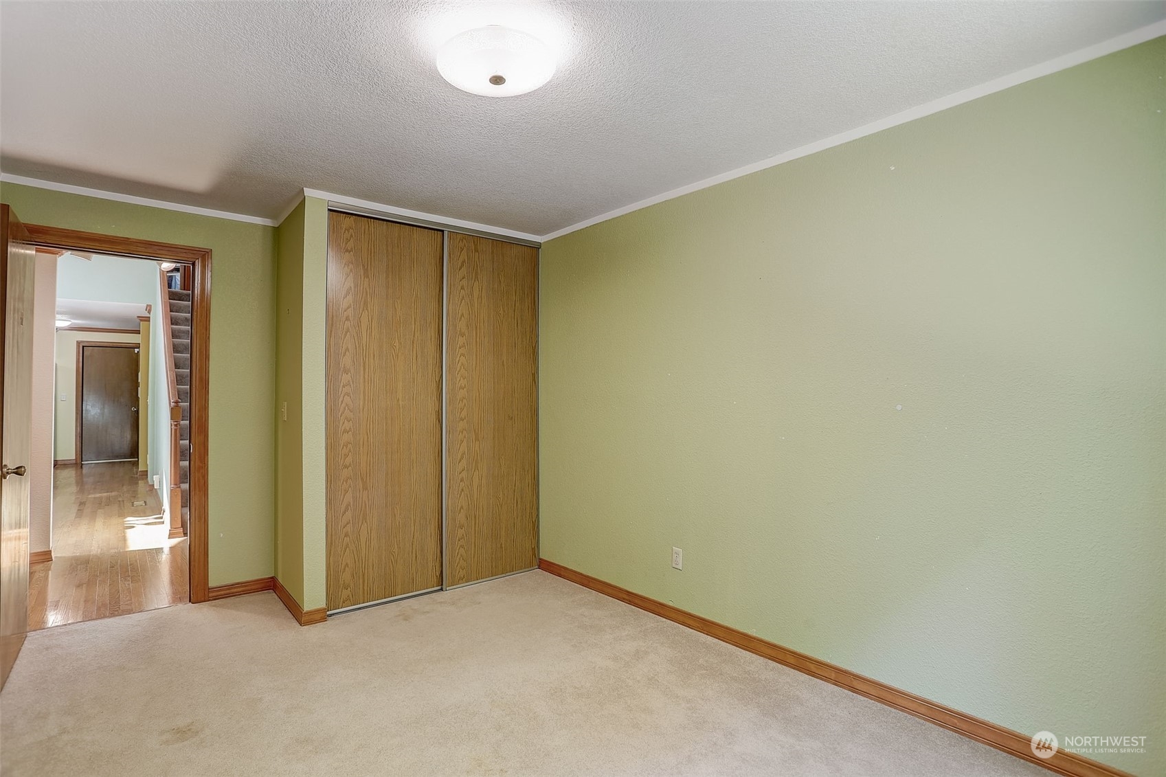 18600 East Spring Lake Drive Southeast Renton, WA 98058 - Photo 21 of 39 an empty room with sliding door