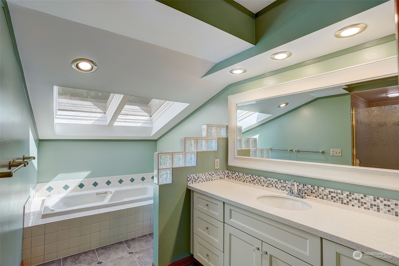 18600 East Spring Lake Drive Southeast Renton, WA 98058 - Photo 27 of 39 a bathroom with a bathtub sink and mirror