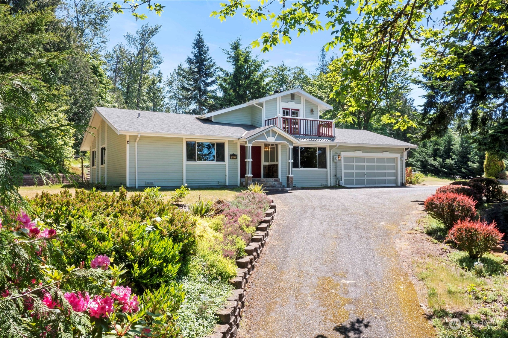18600 East Spring Lake Drive Southeast Renton, WA 98058 - Photo 29 of 39 a front view of a house with a yard and garage