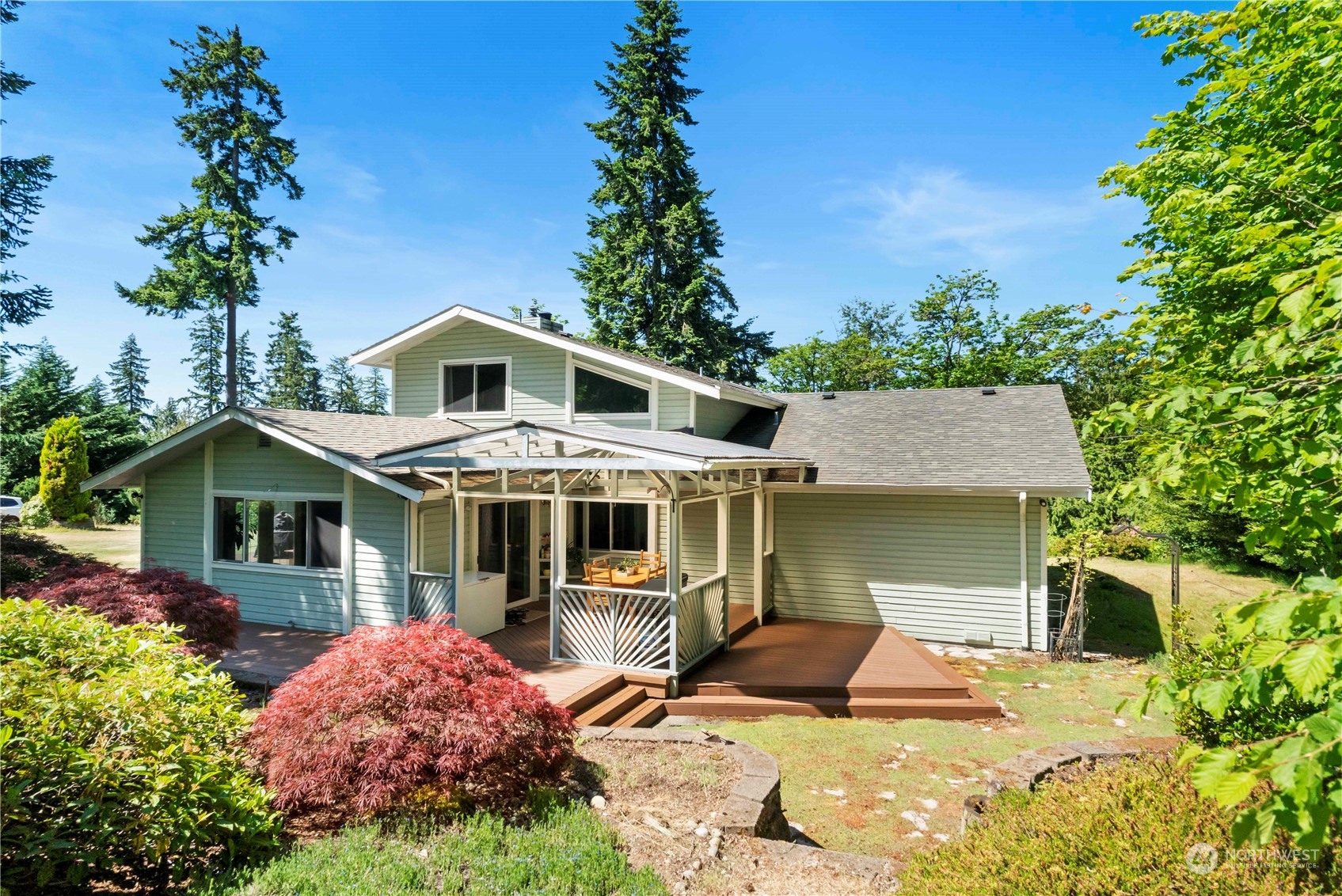 18600 East Spring Lake Drive Southeast Renton, WA 98058 - Photo 31 of 39 a front view of a house with a garden