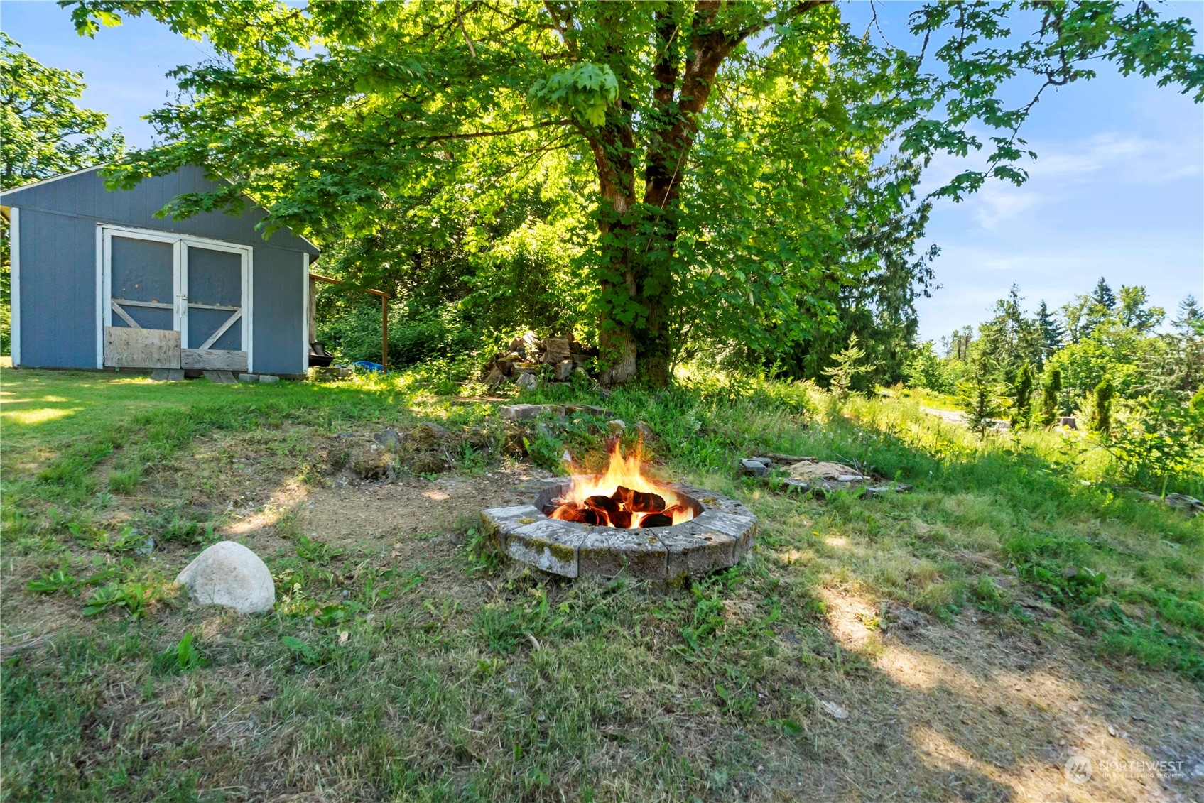 18600 East Spring Lake Drive Southeast Renton, WA 98058 - Photo 33 of 39 a view of a house with a backyard and a garden