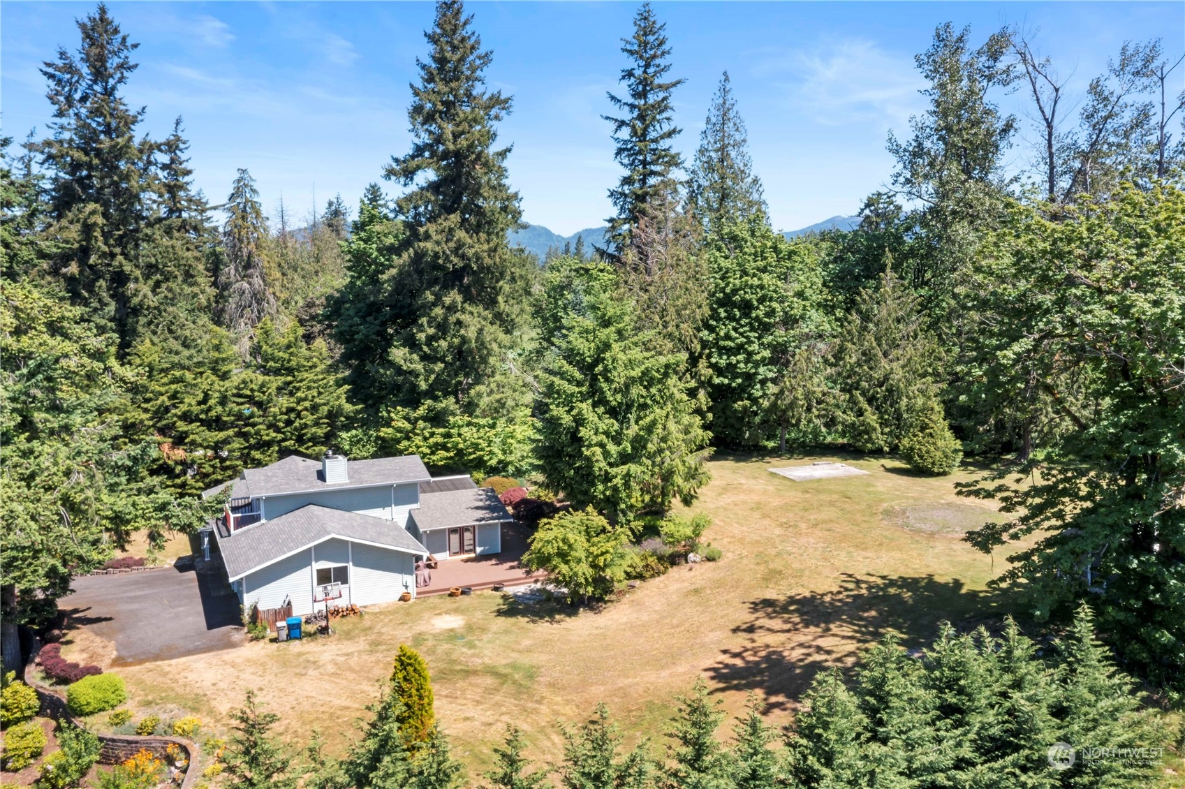 18600 East Spring Lake Drive Southeast Renton, WA 98058 - Photo 34 of 39 an aerial view of a house with a yard and trees all around