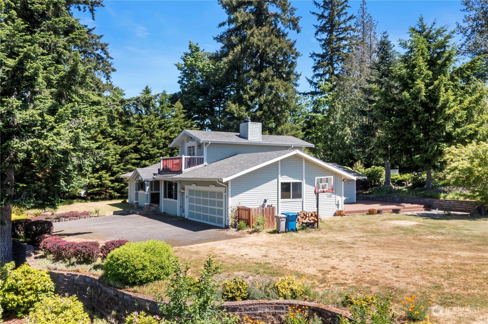 18600 East Spring Lake Drive Southeast Renton, WA 98058 - Photo 35 of 39 a front view of a house with a yard and garage