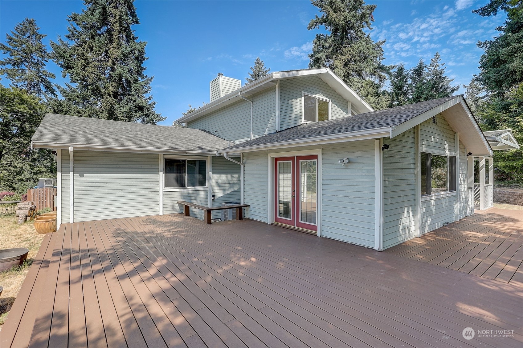 18600 East Spring Lake Drive Southeast Renton, WA 98058 - Photo 37 of 39 a front view of a house with a garden and porch