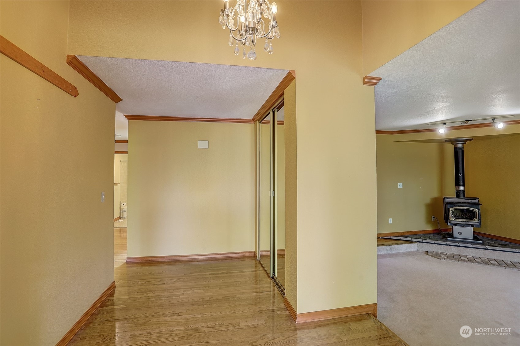 18600 East Spring Lake Drive Southeast Renton, WA 98058 - Photo 5 of 39 a view of a livingroom with wooden floor and a ceiling fan