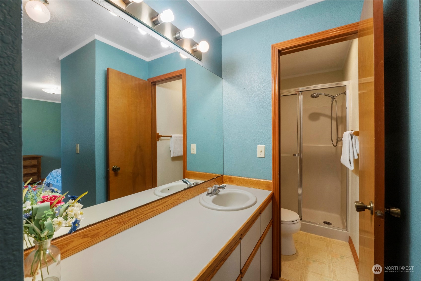 18600 East Spring Lake Drive Southeast Renton, WA 98058 - Photo 7 of 39 a bathroom with a granite countertop sink and a mirror