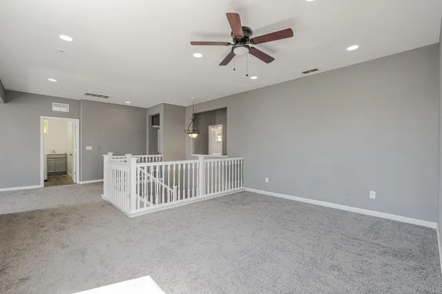 a view of a livingroom with a ceiling fan