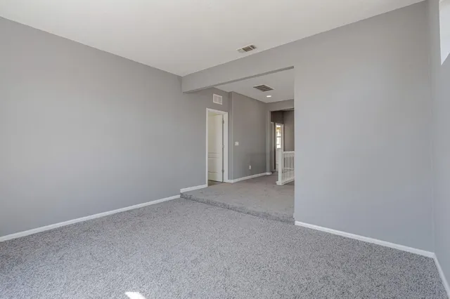 a view of a big room with closet and wooden floor