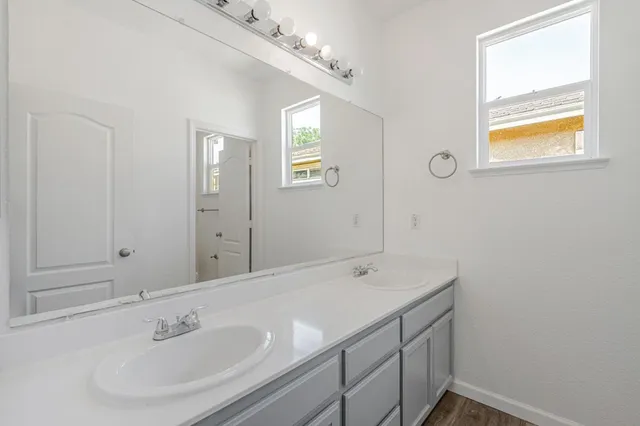 a bathroom with a sink and a mirror