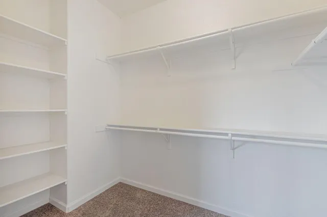a view of an empty walk in closet