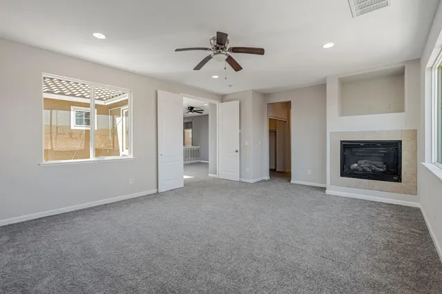 a view of an empty room with a fireplace