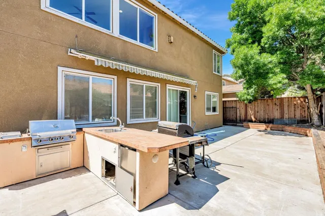 a outdoor space with swimming pool and wooden fence