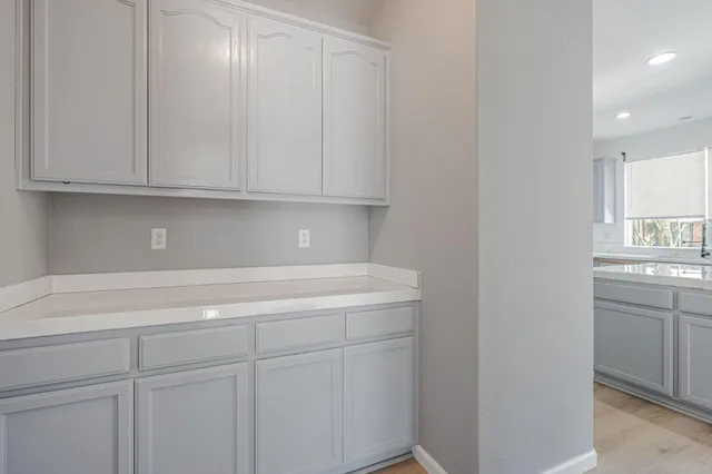 a view of cabinets and window