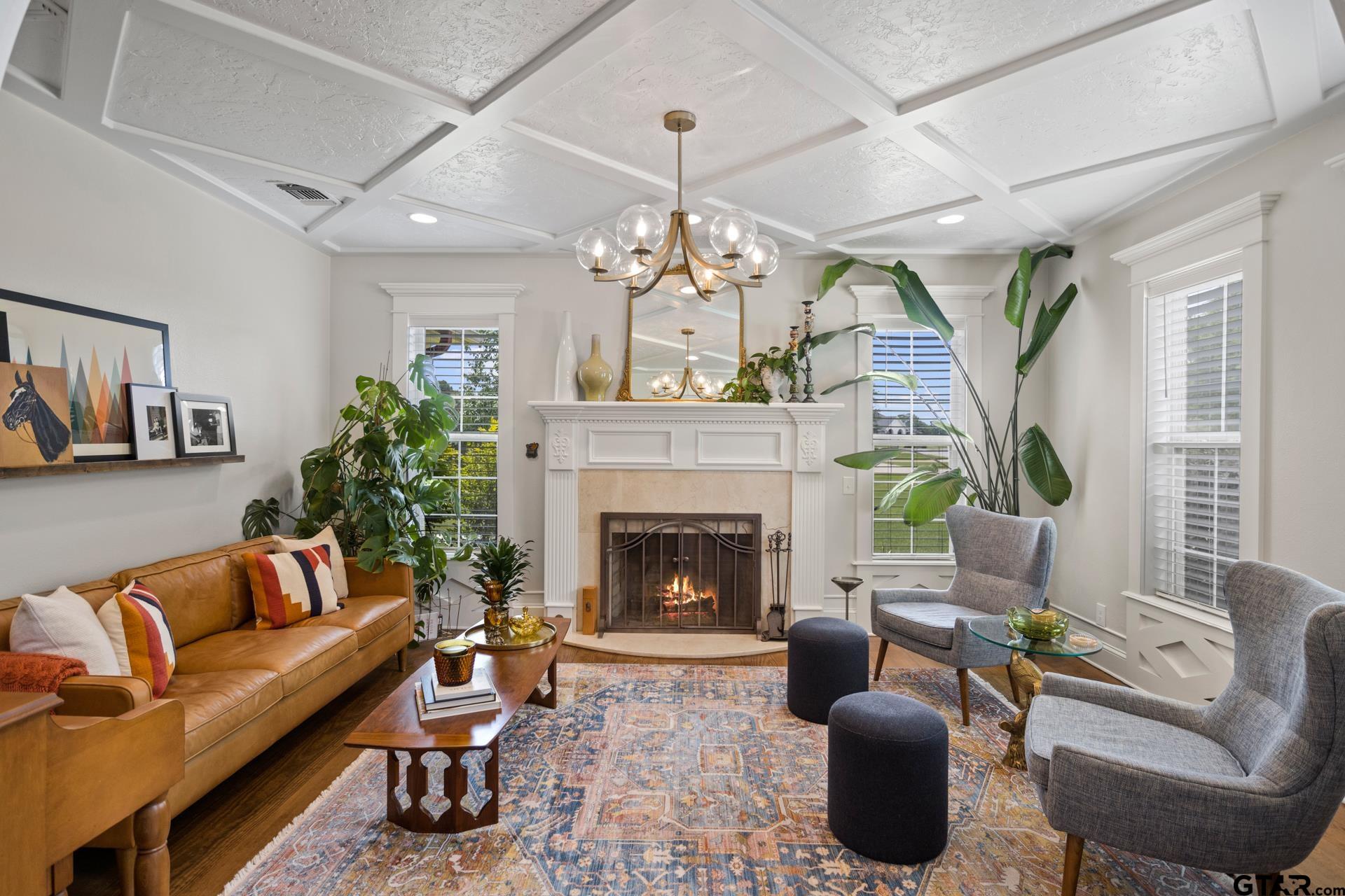 134 Private Road New Boston, TX 75570 - Photo 35 of 40 a living room with furniture a chandelier and a fireplace