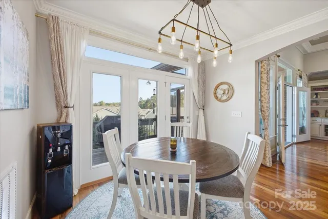a view of a dining room with furniture and window