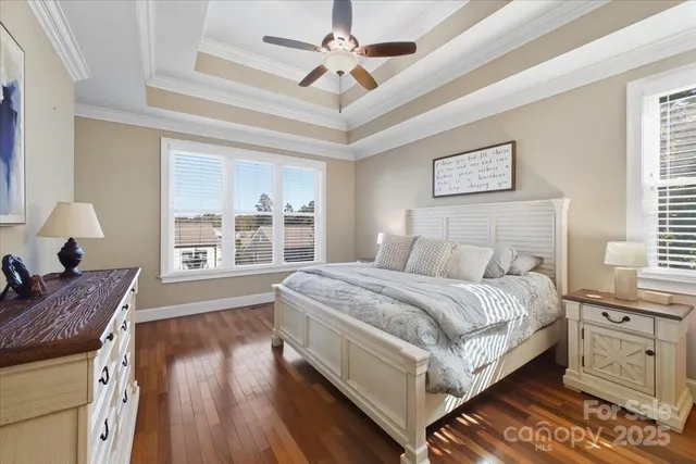 a spacious bedroom with a bed and a window