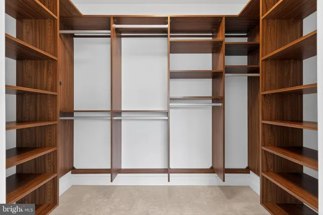 a bathroom with a toilet sink and shower