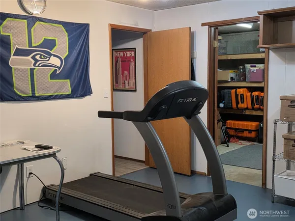 a room with gym equipment and equipment