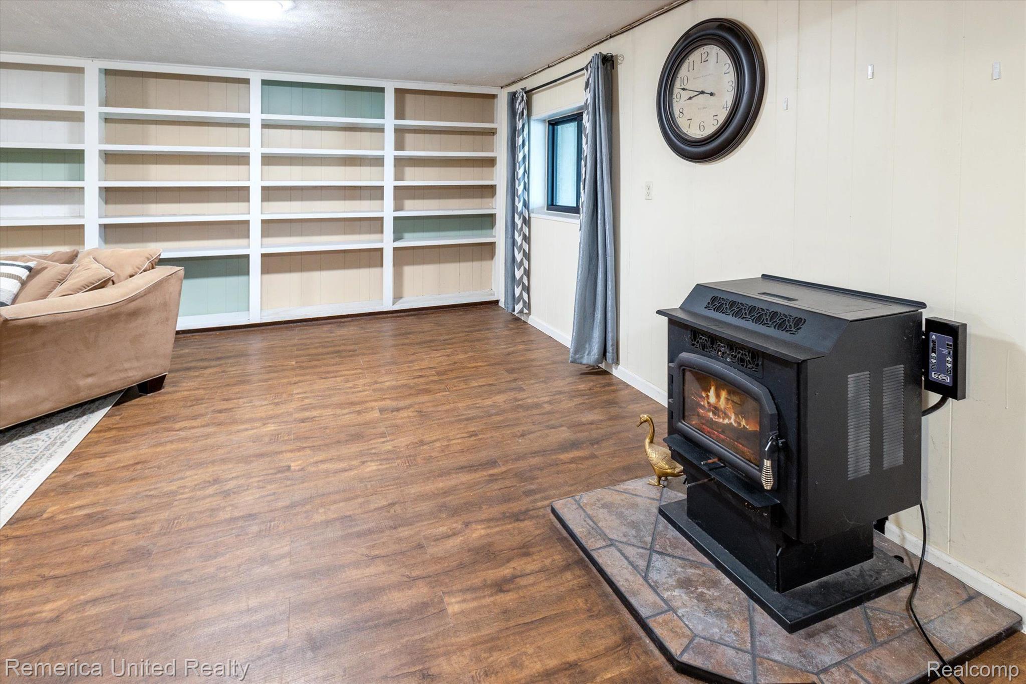 6051 Dutcher Road Howell, MI 48843 - Photo 27 of 42 Pellet stove